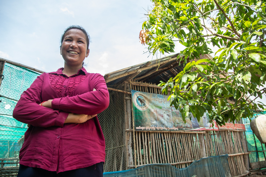 Portraits of Rith Chantha infront of her chicken coop.